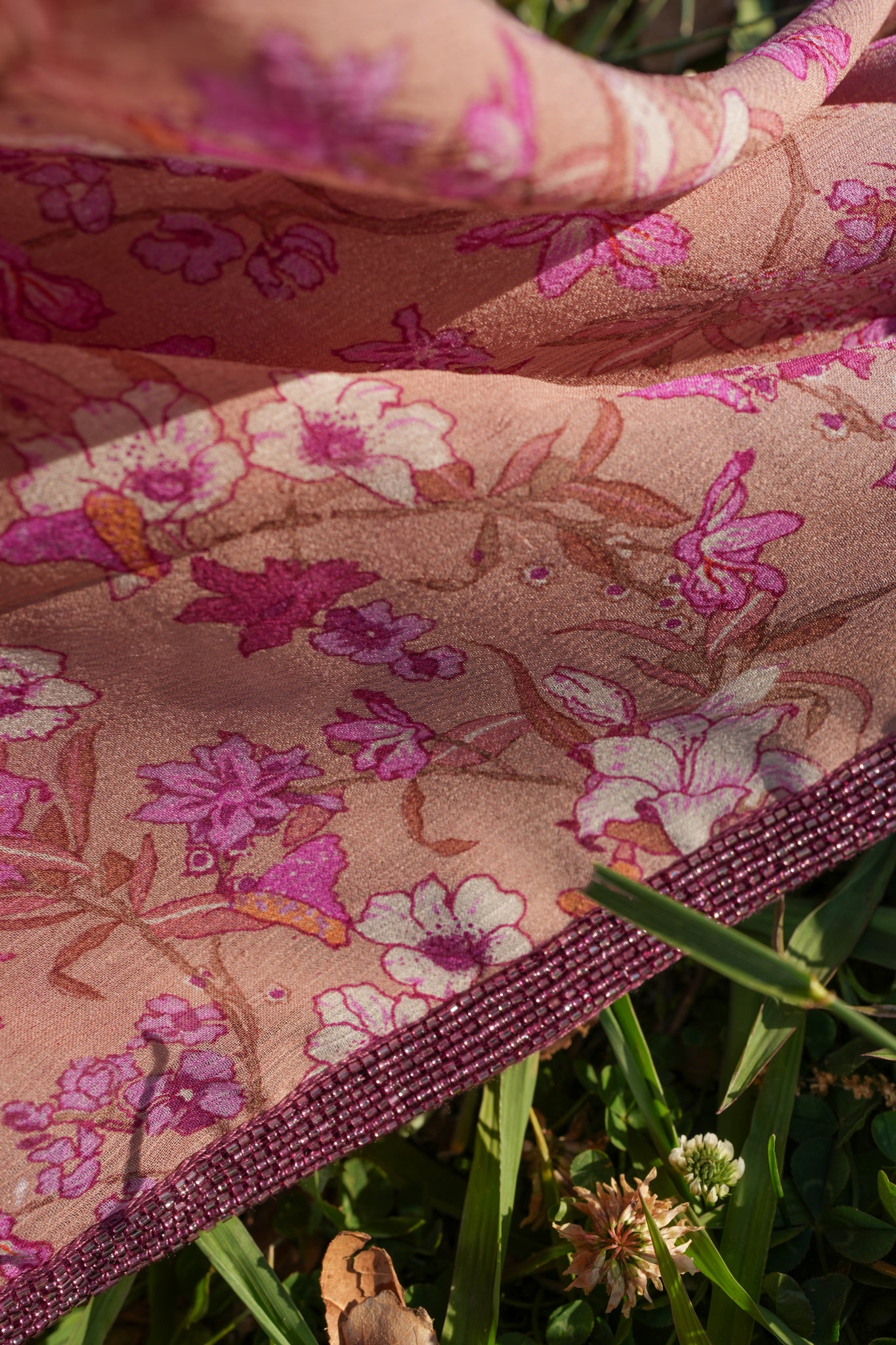 Printed chiffon saree with hand embroidered border