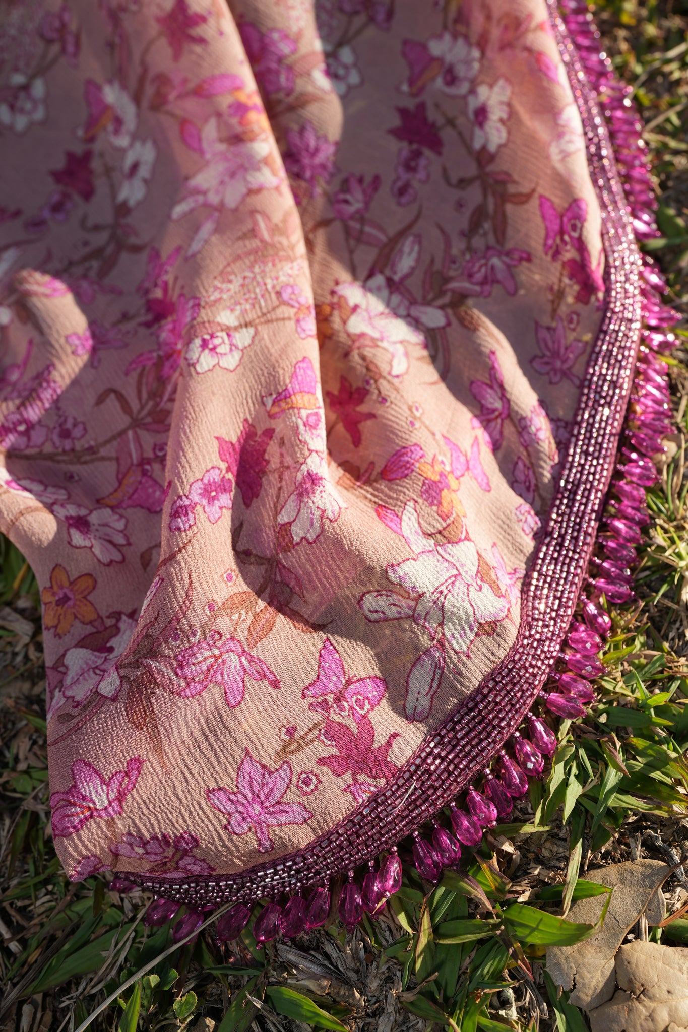 Printed chiffon saree with hand embroidered border