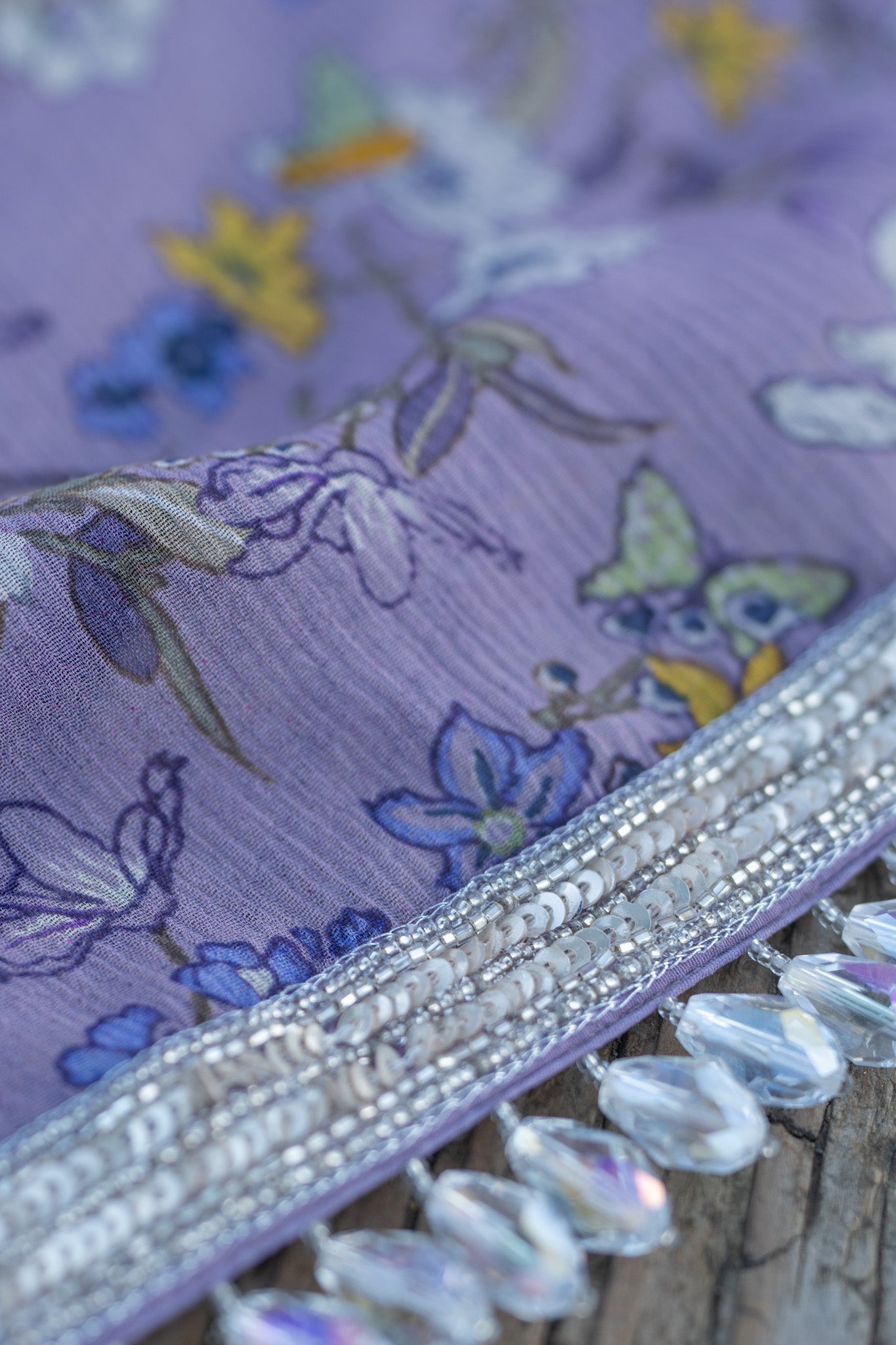 Printed chiffon saree with hand embroidered border