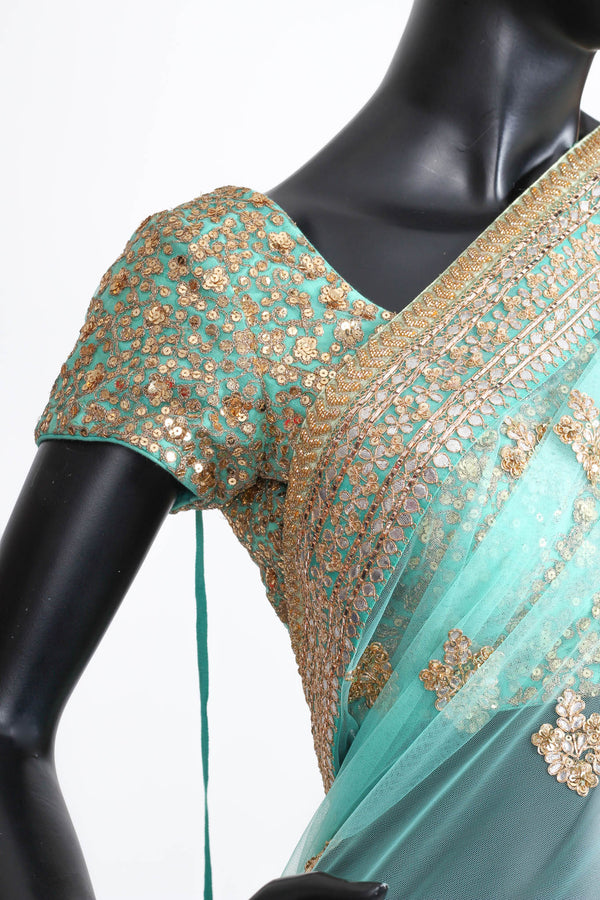 Sabyasachi turquoise tulle saree with gota embroidery
